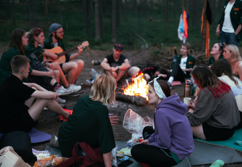 friends by campfire