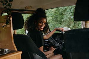 Person looking back while in driver seat