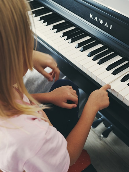A little girl named Chloe playing piano