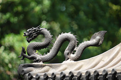 Dragon in front of trees