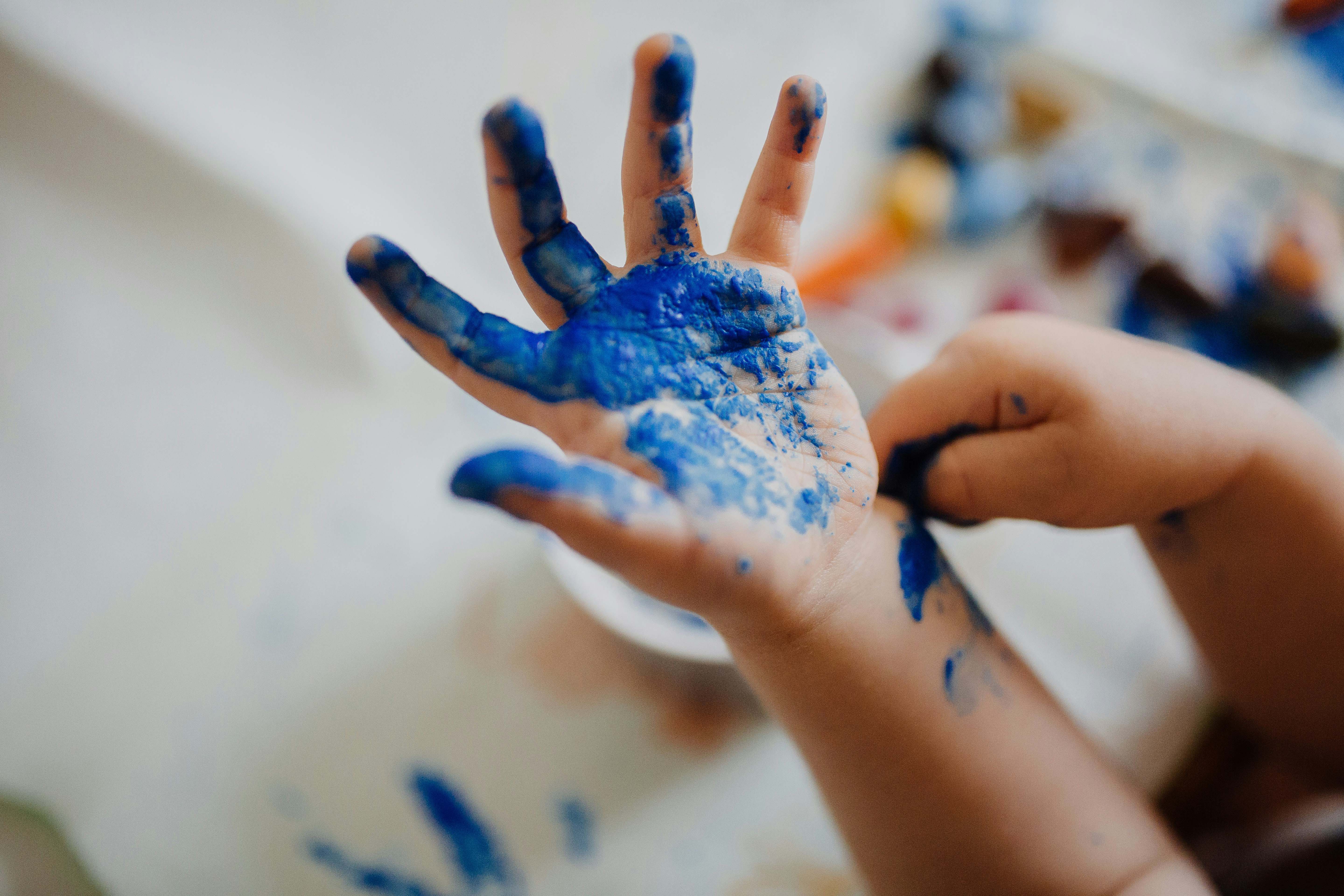 Children creating art with paint
