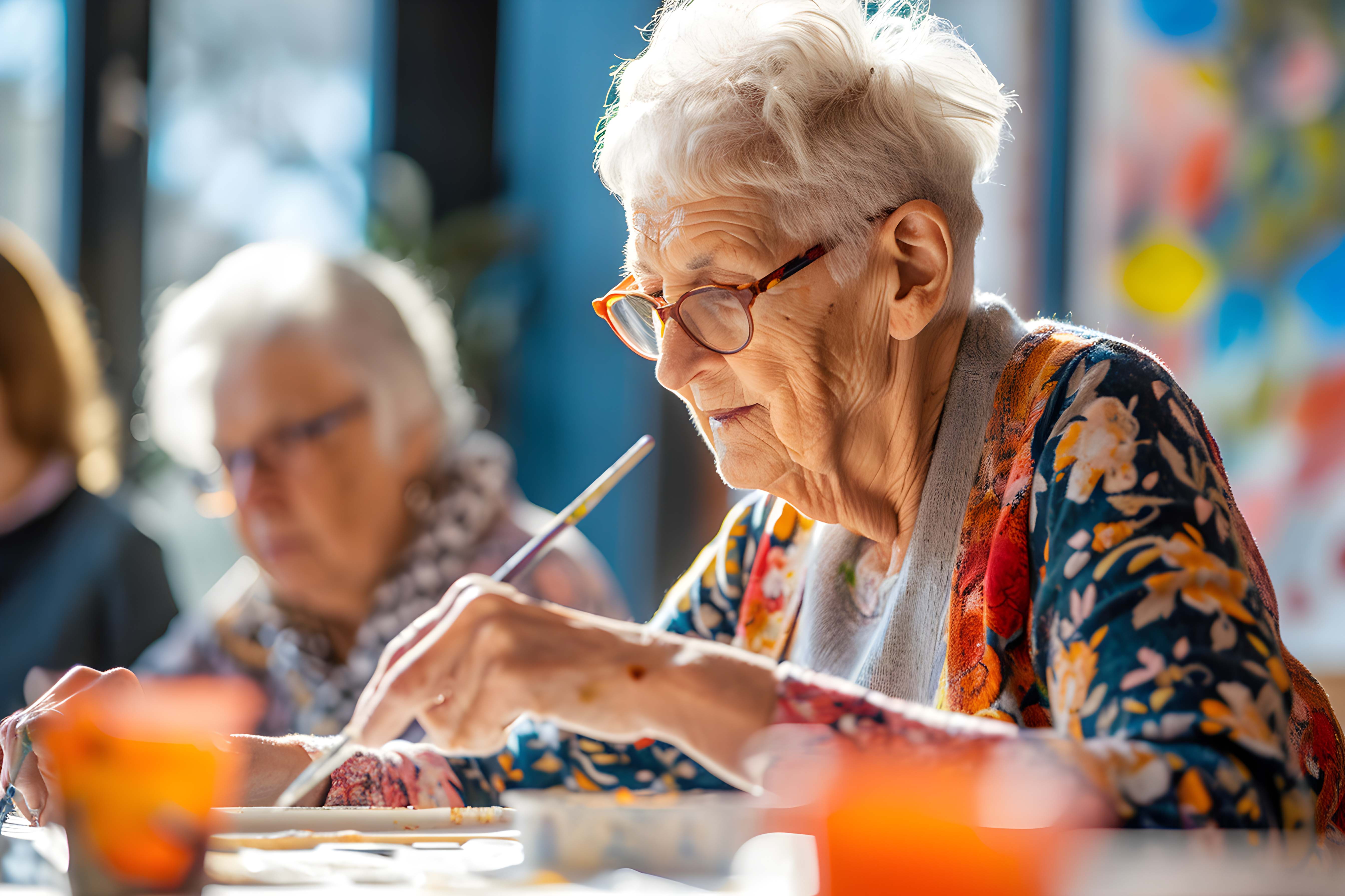 Senior woman painting with focus and joy
