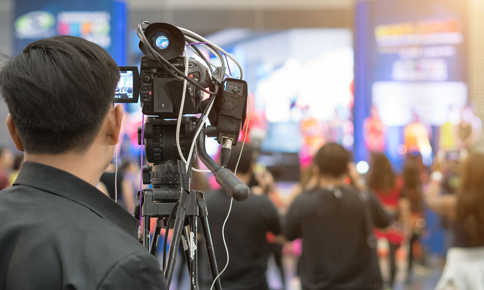Cameraman filming lecture hall
