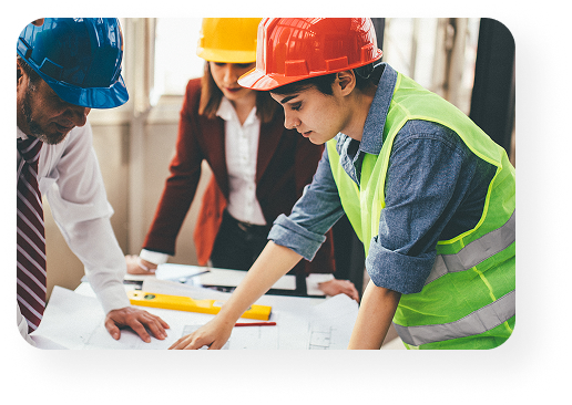 employees chatting around plans wearing saftey gear