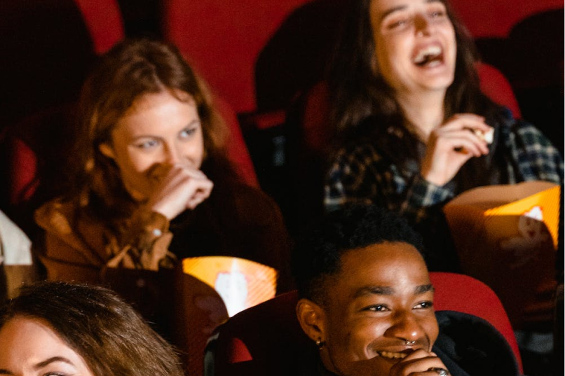 People laughing at the movie theater