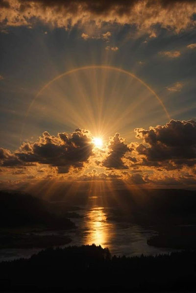 sun rising over the clouds