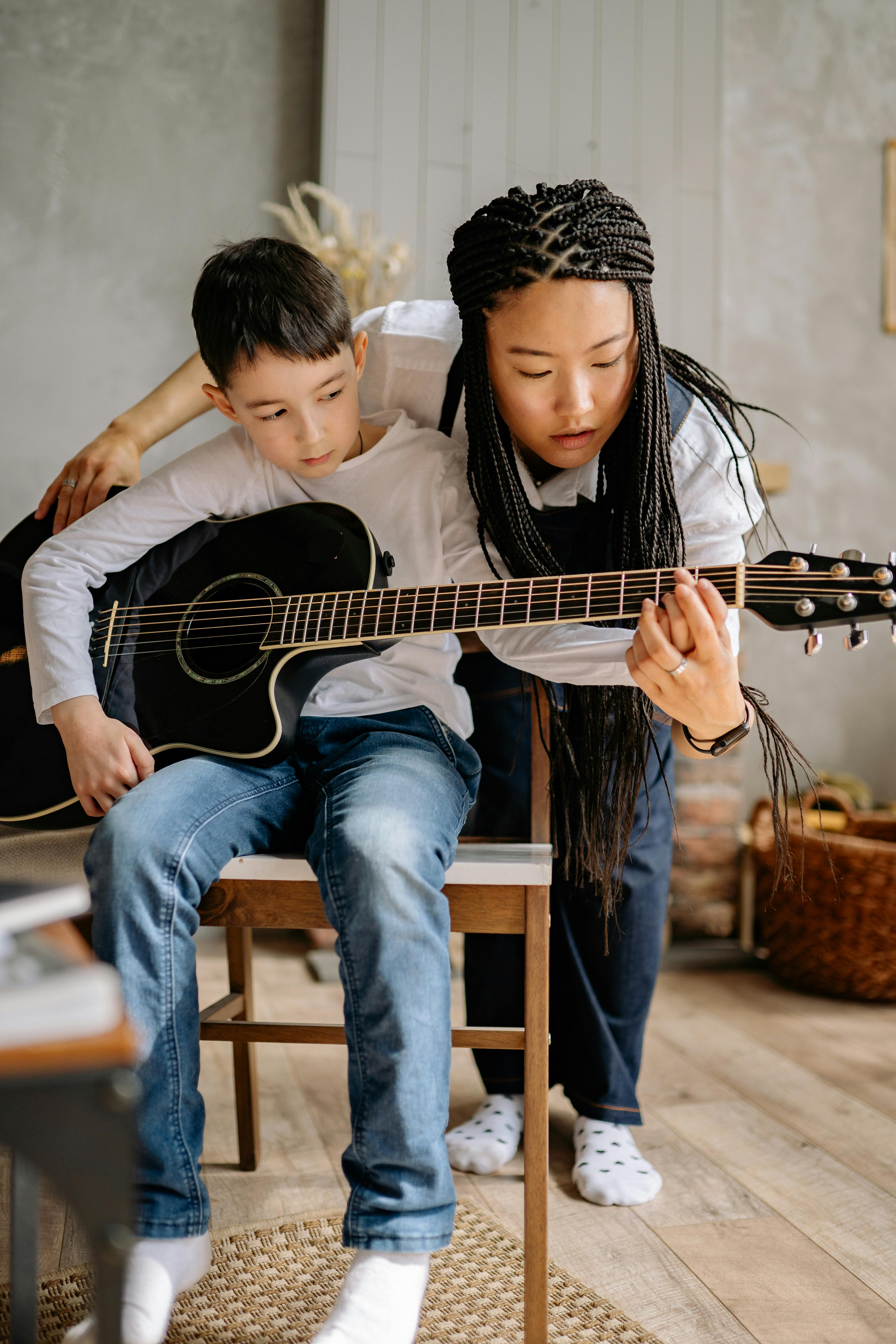 Kids learning guitar