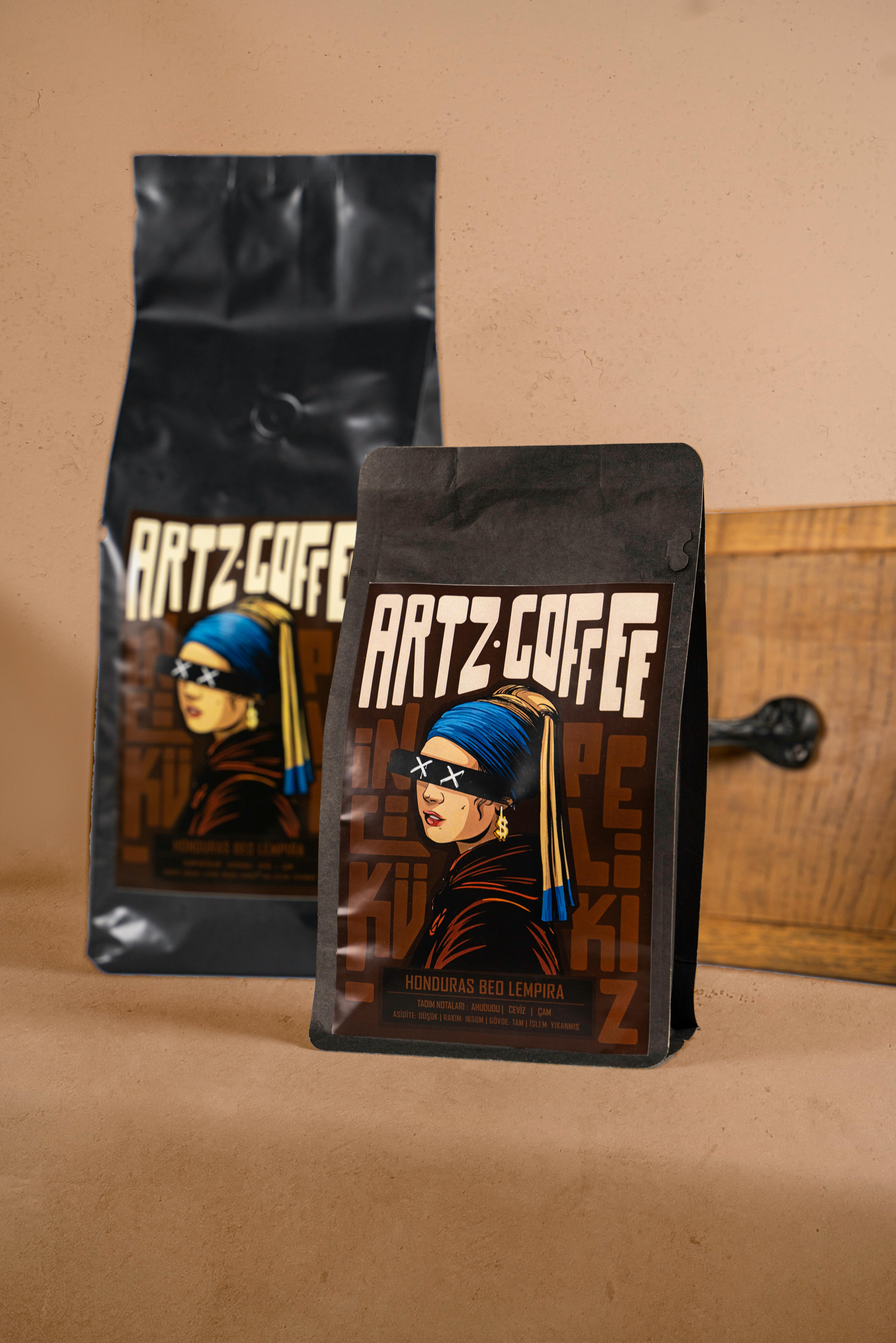 black coffee ground bag with a drawing of a woman