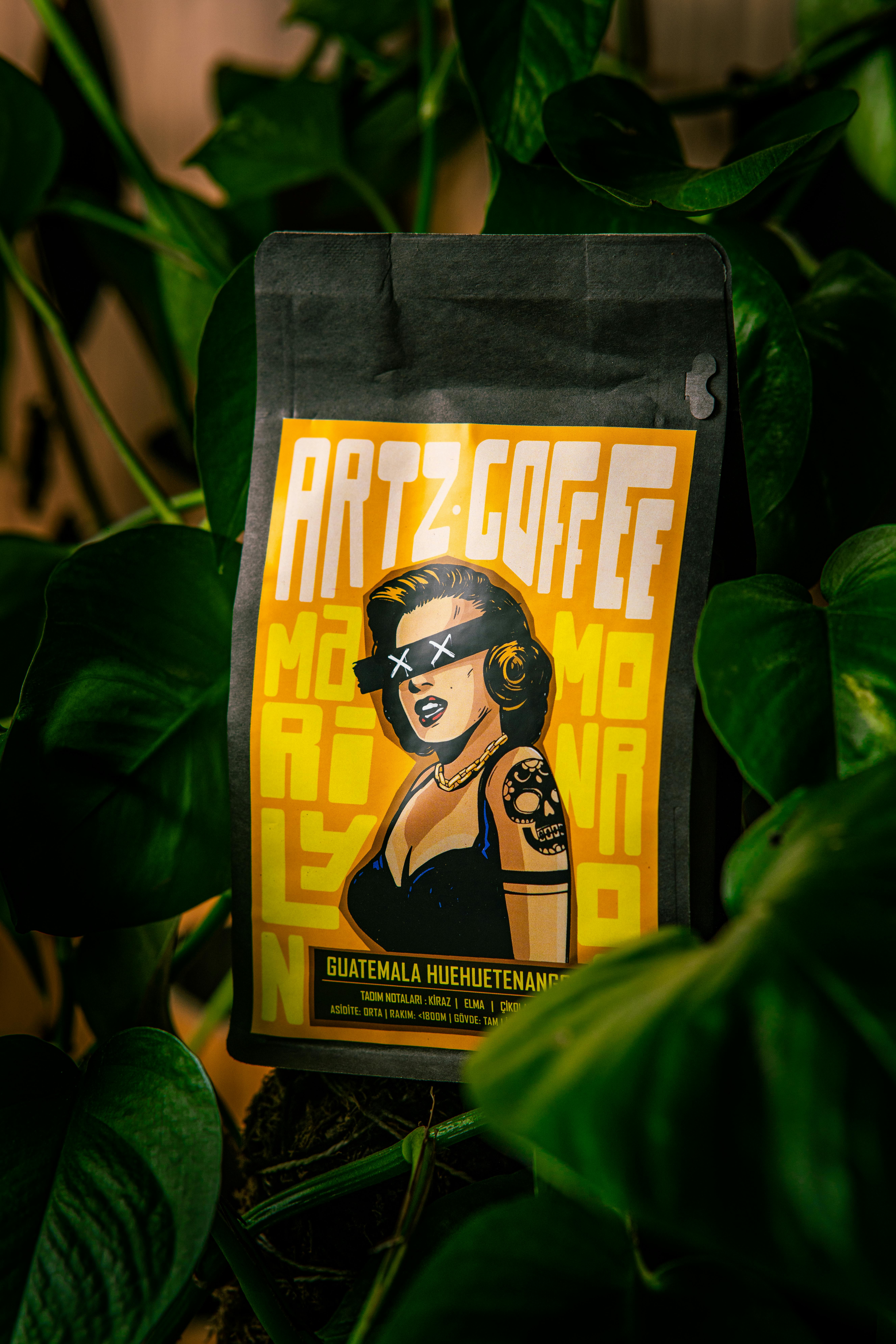 black coffee ground bag with a drawing of a woman