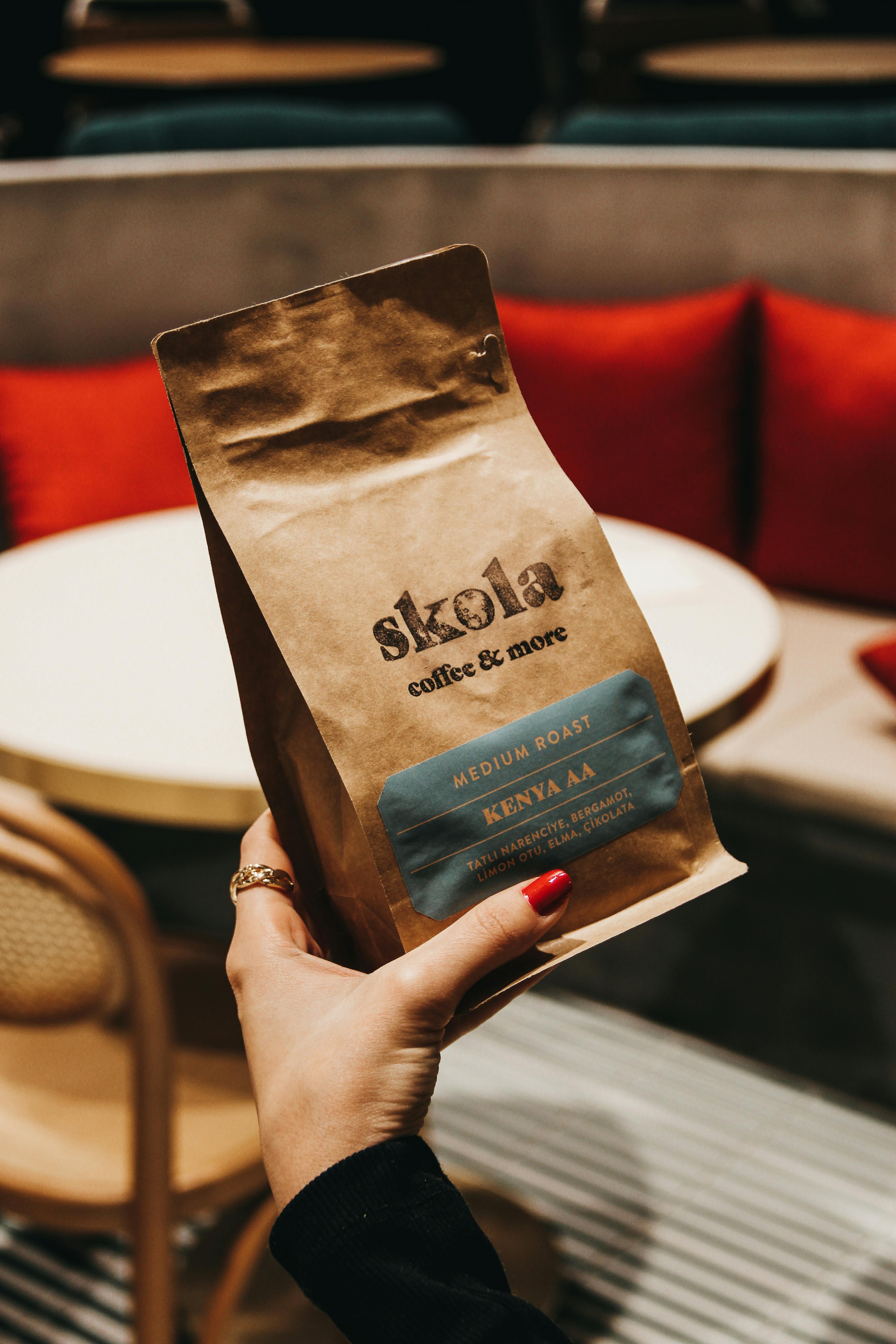 black coffee ground bag with a drawing of a woman